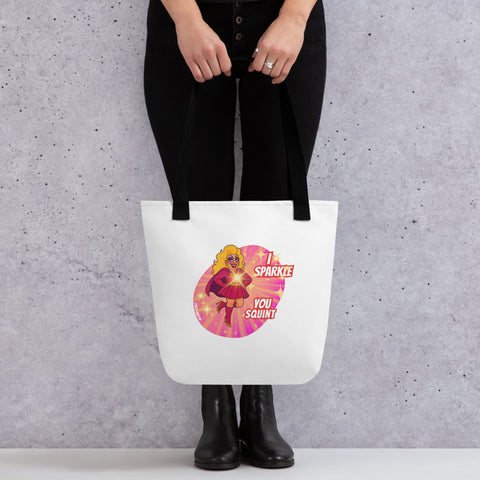 White tote bag with 'I Sparkle, You Squint Drag Queen Supreme Tote Bag' design — Totes first.