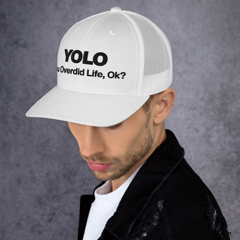 White retro trucker hat with 'YOLO Retro Hat (Black Thread)' design — Emotional support fashion with shade and ventilation.