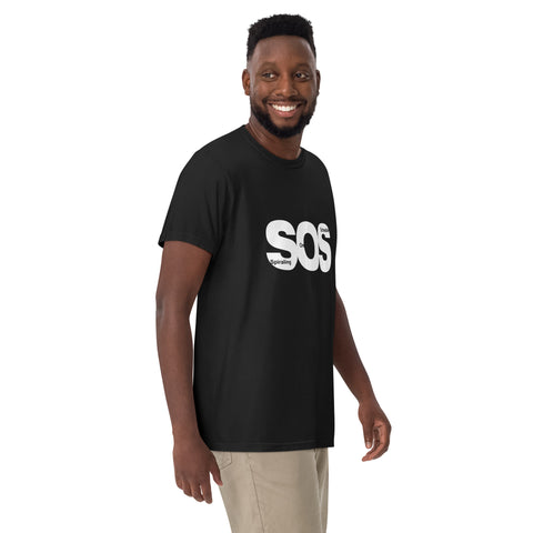 Black unisex garment-dyed heavyweight t-shirt with 'SOS Unisex Tee Black' design — Emotional support clothing for those who calendar their chaos.