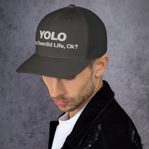Charcoal retro trucker hat with 'YOLO Retro Hat (White Thread)' design — Emotional support fashion with shade and ventilation.