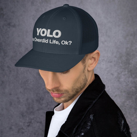 Navy retro trucker hat with 'YOLO Retro Hat (White Thread)' design — Emotional support fashion with shade and ventilation.